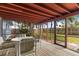 View from the screened porch towards the fenced backyard, providing a private outdoor space with lots of shade trees at 10 Juniper Dr, Ormond Beach, FL 32176