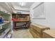 Organized storage room featuring shelving, workbench, tools, and ample space for storing a variety of items at 10 Juniper Dr, Ormond Beach, FL 32176