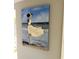 A beautifully captured painting of a Personal on a beach, adding an artistic touch to the wall at 64 Ocean Palm S Dr # 64, Flagler Beach, FL 32136