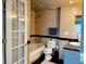 Bathroom featuring a soaking tub, dark granite countertop, toilet, and tiled walls at 64 Ocean Palm S Dr # 64, Flagler Beach, FL 32136