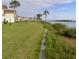 Condos with a green lawn and landscaping near the water provide a peaceful retreat at 64 Ocean Palm S Dr # 64, Flagler Beach, FL 32136
