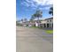 Lovely building exterior features manicured landscaping, private entrances and ample parking at 64 Ocean Palm S Dr # 64, Flagler Beach, FL 32136