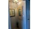 Hallway featuring an decorative mirror, artwork, and interior door at 64 Ocean Palm S Dr # 64, Flagler Beach, FL 32136