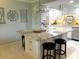 Spacious kitchen island with seating, granite countertops, and ample storage space at 64 Ocean Palm S Dr # 64, Flagler Beach, FL 32136