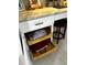 Kitchen desk features pull-out drawers, bar stool seating, and granite countertops at 64 Ocean Palm S Dr # 64, Flagler Beach, FL 32136