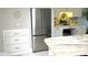 Modern kitchen features a stainless steel refrigerator, custom cabinets, granite countertops, and tile backsplash at 64 Ocean Palm S Dr # 64, Flagler Beach, FL 32136