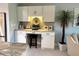 Contemporary kitchen features a built-in desk with storage, granite countertops, and a stylish backsplash at 64 Ocean Palm S Dr # 64, Flagler Beach, FL 32136