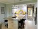 Spacious kitchen area features a large island with granite countertop, bar stool seating, and modern appliances at 64 Ocean Palm S Dr # 64, Flagler Beach, FL 32136