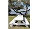 Scenic picnic area with a white picnic table by the water at 64 Ocean Palm S Dr # 64, Flagler Beach, FL 32136