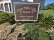 Ocean Palm Villas South sign amid manicured landscaping provides important neighborhood information at 64 Ocean Palm S Dr # 64, Flagler Beach, FL 32136