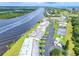 Stunning aerial view showcases waterfront community with manicured lawns and ample parking at 50 Ocean Palm Villa S, Flagler Beach, FL 32136