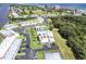An aerial shot of pristine condos, community pool, lush landscaping and water views at 50 Ocean Palm Villa S, Flagler Beach, FL 32136