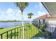 Enjoy the picturesque balcony view overlooking lush green grass and the tranquil river in this coastal community at 50 Ocean Palm Villa S, Flagler Beach, FL 32136