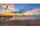 Sunrise on the beach with calm ocean waters and dramatic sky at 50 Ocean Palm Villa S, Flagler Beach, FL 32136