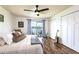 Cozy bedroom features a serene lake view, ceiling fan, and spacious closet at 50 Ocean Palm Villa S, Flagler Beach, FL 32136