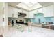 Bright kitchen boasts white cabinets, granite counters, stainless appliances, and an open design at 50 Ocean Palm Villa S, Flagler Beach, FL 32136