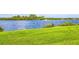 Serene lawn view of the water and a boat on the river in this waterfront community at 50 Ocean Palm Villa S, Flagler Beach, FL 32136