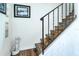Unique staircase design with wood accents and a decorative mermaid statue at 50 Ocean Palm Villa S, Flagler Beach, FL 32136