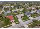 Aerial view of neighborhood with lake and homes at 928 George Hecker Dr, South Daytona, FL 32119
