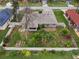 Aerial view showcasing house and backyard landscaping at 928 George Hecker Dr, South Daytona, FL 32119