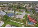 Aerial view showing the home's setting and solar panels at 928 George Hecker Dr, South Daytona, FL 32119