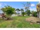 Spacious backyard with lush tropical landscaping at 928 George Hecker Dr, South Daytona, FL 32119