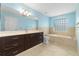 Bathroom features a large soaking tub and dark vanity at 928 George Hecker Dr, South Daytona, FL 32119