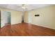 Large bedroom with hardwood floors and access to bathroom at 928 George Hecker Dr, South Daytona, FL 32119