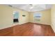 Spacious bedroom with hardwood floors and ceiling fan at 928 George Hecker Dr, South Daytona, FL 32119