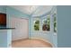 Bright breakfast nook with bay windows and tiled flooring at 928 George Hecker Dr, South Daytona, FL 32119