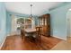 Formal dining room with hardwood floors and a large window at 928 George Hecker Dr, South Daytona, FL 32119