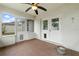 Enclosed patio with tile flooring and double doors at 928 George Hecker Dr, South Daytona, FL 32119