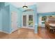 Bright entryway with tiled flooring and access to the backyard at 928 George Hecker Dr, South Daytona, FL 32119