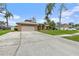 Brick house with attached garage and well-manicured lawn at 928 George Hecker Dr, South Daytona, FL 32119
