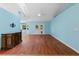 Spacious living room with hardwood floors and light blue walls at 928 George Hecker Dr, South Daytona, FL 32119