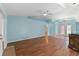 Spacious living area with hardwood floors and light blue walls at 928 George Hecker Dr, South Daytona, FL 32119