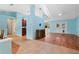 Open living area with light blue walls and wood flooring at 928 George Hecker Dr, South Daytona, FL 32119