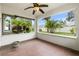 Bright sunroom with tiled floor and view of backyard at 928 George Hecker Dr, South Daytona, FL 32119