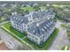 Stunning aerial view of multi-Gathering home with manicured landscaping and close to golf course at 280 Celebration Blvd # 203, Celebration, FL 34747