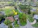 An aerial view displays the property backing up to the golf course at 100 Longspur Ct, Daytona Beach, FL 32119