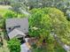 An aerial view showcasing the property's location with beautiful trees surrounding the residence at 100 Longspur Ct, Daytona Beach, FL 32119