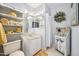 Charming bathroom with decorative shelves, mirrors, and tiled flooring at 100 Longspur Ct, Daytona Beach, FL 32119