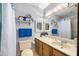 Bathroom featuring a marble countertop, wooden cabinets, and blue accents at 100 Longspur Ct, Daytona Beach, FL 32119