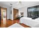 Nicely furnished bedroom features a ceiling fan, decor, and offers a relaxing view to another bedroom at 100 Longspur Ct, Daytona Beach, FL 32119