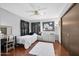 Comfortable bedroom features a ceiling fan, decor, and a workspace area for convenience at 100 Longspur Ct, Daytona Beach, FL 32119