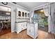 Bright and airy dining area, featuring tile floors, white hutch, and backyard views at 100 Longspur Ct, Daytona Beach, FL 32119
