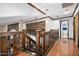 Upper hallway features rich wood accents, views into other rooms, and decorative wood accent wall at 100 Longspur Ct, Daytona Beach, FL 32119