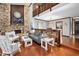 Cozy living area featuring a stone fireplace, hardwood floors, and comfortable seating at 100 Longspur Ct, Daytona Beach, FL 32119