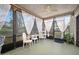 Screened-in porch with natural light and furniture set at 100 Longspur Ct, Daytona Beach, FL 32119