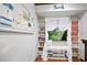 Cozy reading nook is surrounded by bookshelves and a charming window seat for relaxation at 100 Longspur Ct, Daytona Beach, FL 32119